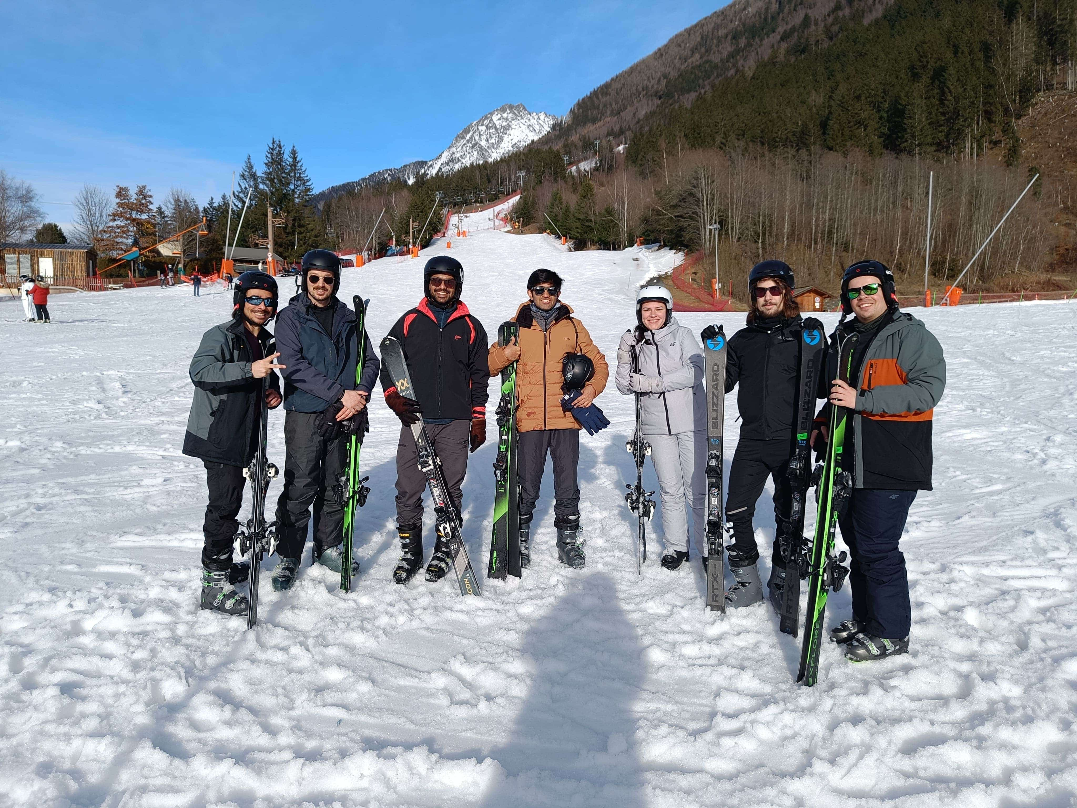 MUI team members standing lined-up in the snow with their skigear.